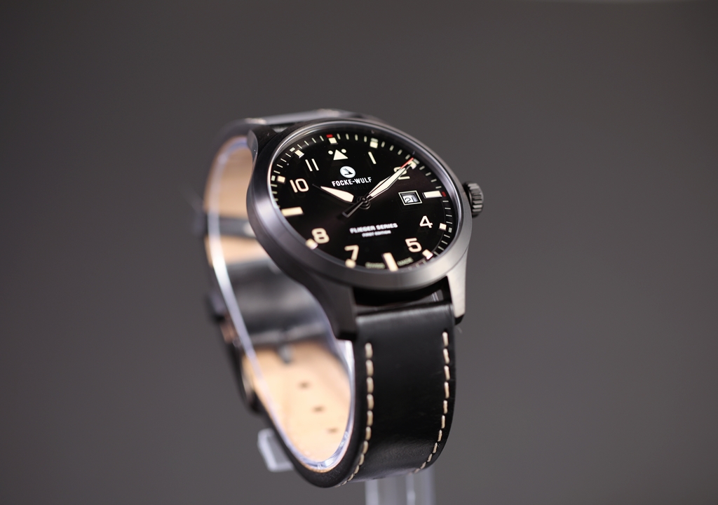 Flieger watch on a display stand